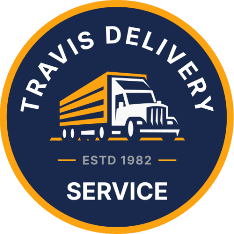 Travis Delivery Service logo, circle design with a blue background and a yellow border. Features the text Travis Delivery at the top and the text Service at the bottom in white. Near the bottom is the text ESTD 1982 in grey. In the middle is a flat drawing of an 18 wheeler with a white cab and a yellow trailer.